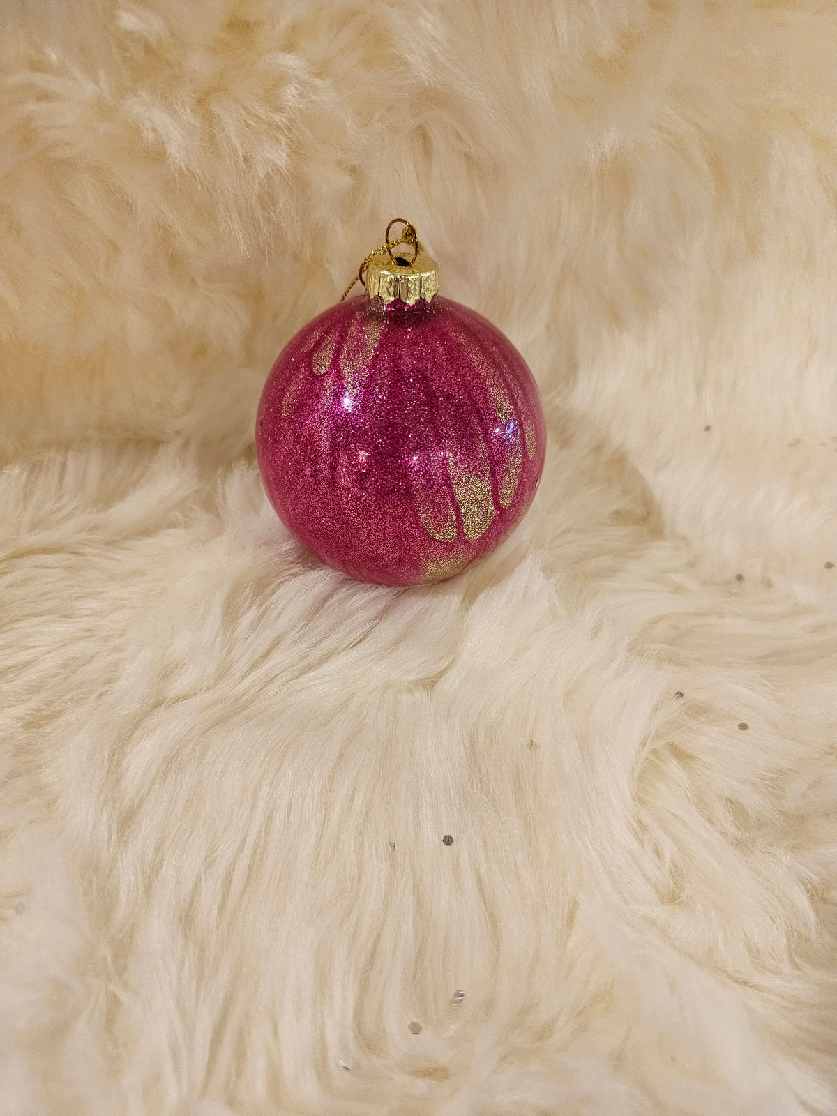 Pink ornament with gold accents